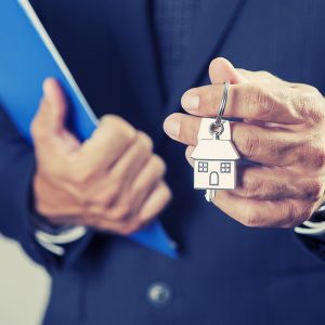 Man holding House keys